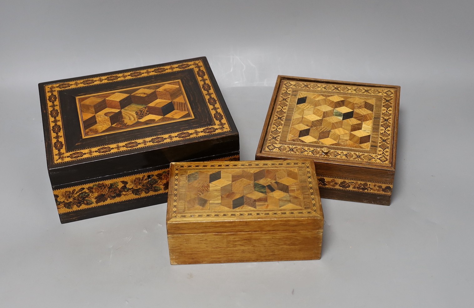 Three 19th century Tunbridge ware perspective cube marquetry boxes, largest 20cm